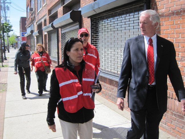 Bridgeport Mayor Bill Finch (at right) walks with Connecticut AARP State Director Nora Duncan observing conditions on East Main Street in Bridgeport, Conn. Walking behind them are AARP volunteer Mike Klein, Bridgeport City Councilwoman Lydia Martinez, and Bridgeport Director of Social Services Iris Molina.