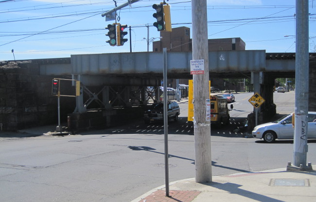 Pedestrian conditions near the viaduct which carries the New Haven Line over E. Main St are particularly poor.