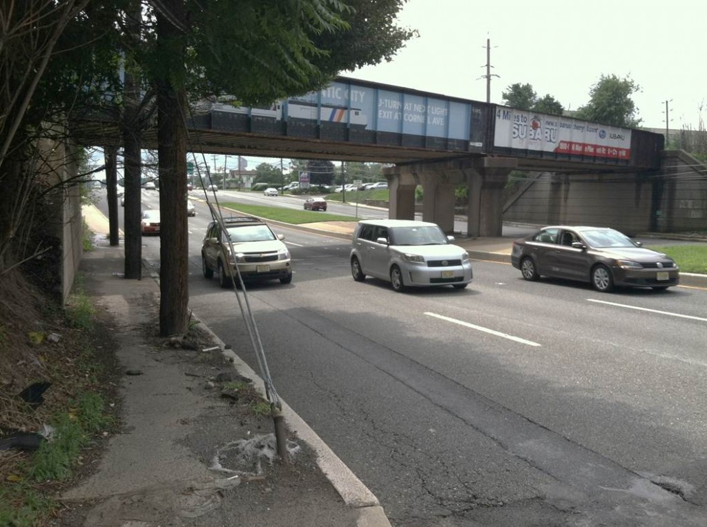 Route 70 at Garden State Boulevard. Pedestrians walking from the Cherry Hill train station and area bus stops must navigate this narrow and dangerous stretch of "sidewalk" to reach area businesses. 